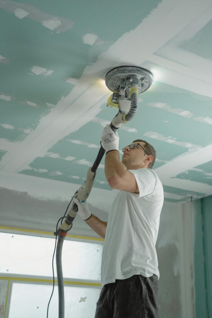 ceiling drywall being sanded